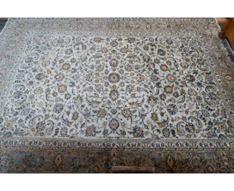 A Central Persian signed Kashan carpet, pale celadon ground with well-executed floral vine design, 430 x 312 cm 