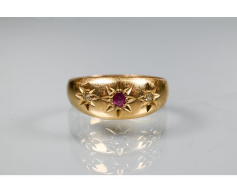 An 18ct yellow gold three stone gypsy ring set ruby and two diamonds, Chester 1914, size M 1/2, approx 3.4g 