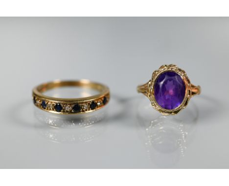 A 9ct yellow gold ring set oval amethyst, size M to/w a 9ct yellow gold half eternity ring set sapphires and diamonds, size S