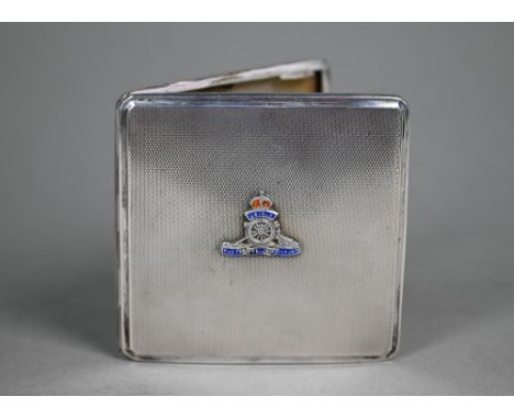 An engine-turned silver cigarette case, mounted with enamelled Royal Artillery badge, Thomas William Lack, London 1939, 3.1oz