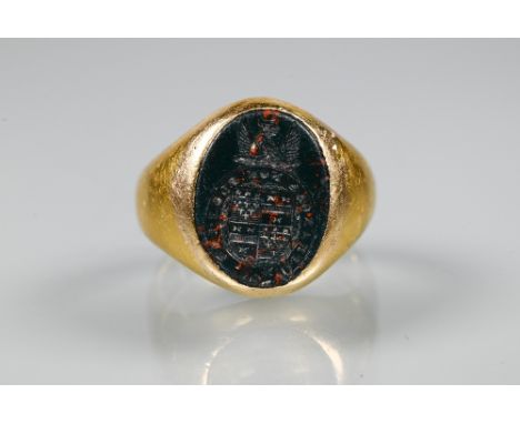 A yellow metal signet ring inset with bloodstone intaglio, unmarked, approx 11g all in, size I 