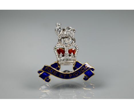 A diamond set 9ct yellow and white gold British Army Pay Corps sweetheart brooch with blue and red enamel decoration, in fitt