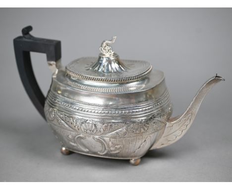 A Victorian silver tea pot in the Regency taste, with dolphin finial and composite handle, on bun feet, Charles Stuart Harris