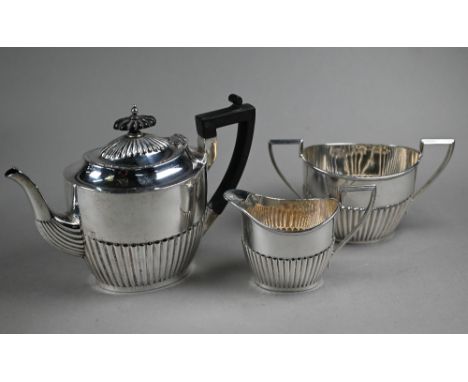 A silver tea service of half-reeded oval form with composite handle and finial, Walker &amp; Hall, Sheffield 1914/15, 27.9oz 