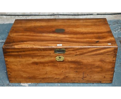 A Victorian brass-bound teak camphor-lined campaign trunk, with folding carrying handles to sides, the interior with paper ma