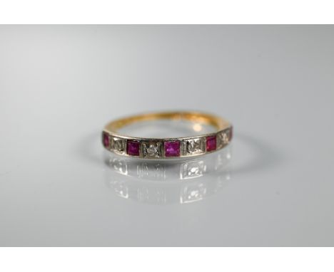 An 18ct yellow gold half eternity ring set rubies and diamonds, size M 1/2, shank worn 