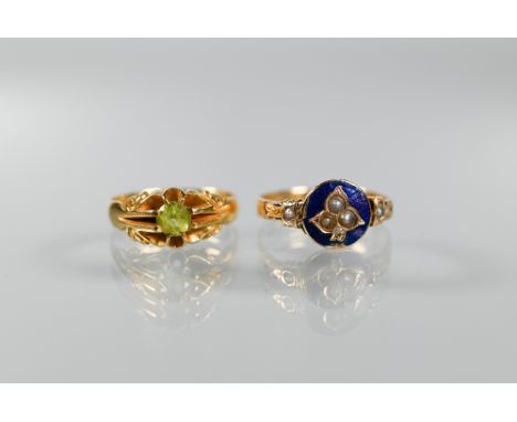 Two Victorian 18ct yellow gold rings, one with blue enamel and seed pearls, size O the other set round peridot, size L (2) 