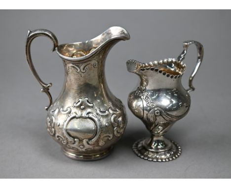 A Victorian silver Rococo Revival pear-shaped cream jug with embossed scrolling decoration, Daniel &amp; Charles Houle, Londo