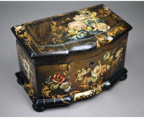 A Victorian lacquered papier maché tea caddy painted and gilded overall with flowers, on bun feet, with two inner lidded comp