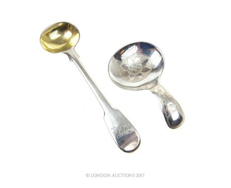 An Edwardian sterling silver caddy spoon, W S Savage & Co, Sheffield 1906, having engraved floral decoration, 6cm long, toget