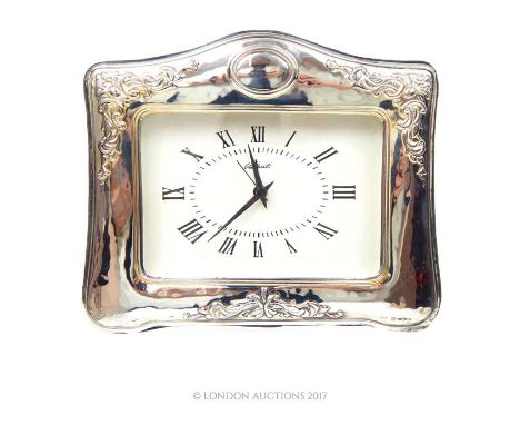 A Continental sterling silver framed mantel clock, having a quartz movement, the dial having Roman numerals and marked Valent