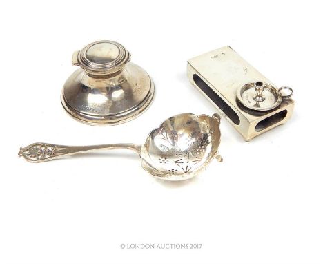 Three silver items including a late Victorian sterling silver matchbox holder decorated with a miniature chamber stick, Mappi