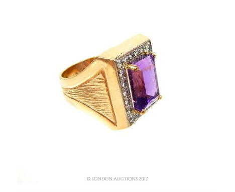 A substantial, 14 ct yellow gold, gentleman's, diamond and amethyst dress ring, centrally set with a large, rectangular, step