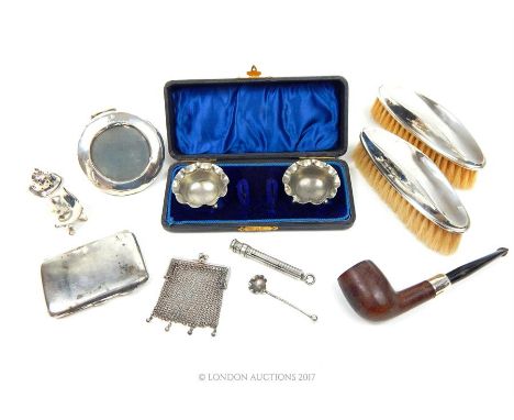 A collection of sterling silver items, including a cigarette case, Sydney & Co, Birmingham 1942, a pepperette, Marson & Jones