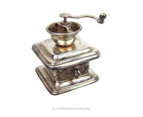 An Edwardian novelty miniature sterling silver coffee grinder, bearing import marks for Chester 1907, Hanau silver, probably 