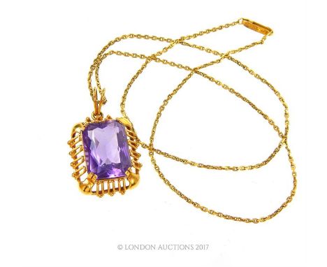 A vintage, 18 ct yellow gold, rectangular amethyst pendant and 14 ct yellow gold chain, the pendant composed of a large, face