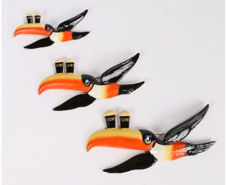 Graduated set of three Carlton Ware Guinness flying toucans, each depicted with two pint glasses to the beaks inscribed my go