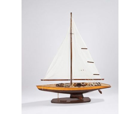 Model depicting a sailing yacht with brown and varnished timber hull, on a brown plinth base with name plate "Australia", 61c