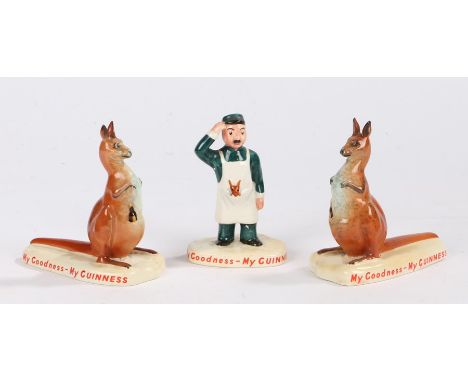 Carlton Ware Guinness figures to include zoo keeper rubbing his head with a joey kangaroo to his apron pocket, two kangaroos 