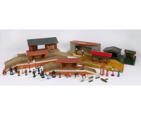 Brimtoy tinplate model railway station with waiting room, two wooden stations, petrol station, siding, collection of painted 