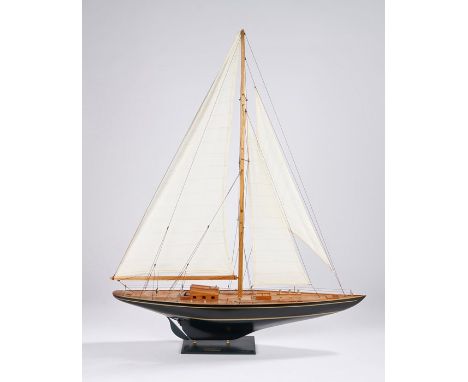 Model depicting a sailing yacht with black hull, on an ebonised plinth base with name plate "Endeavour 1764", 70cm long, 86cm