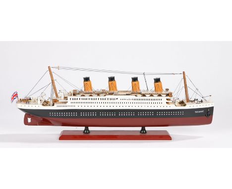 Model depicting RMS Titanic, on a red plinth base with name plate, 54cm long, 19cm high