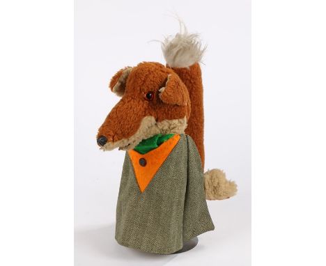 Basil Brush puppet, depicted wearing a tweed jacket with orange collar, with pull-chord voice box to the tail