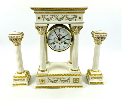 A decorative architectural French style Empress Josephine three piece garniture set to include a bisque porcelain portico clo