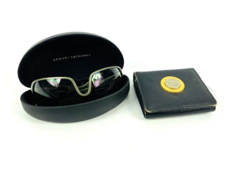 A pair of cased Armani Exchange sunglasses; together with a Gianni Versace leather wallet, 10.5cms wide x 9cms deep. Estimate
