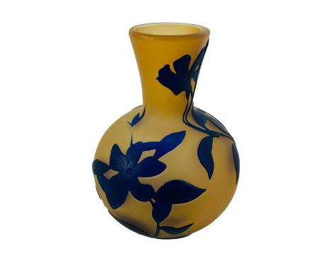 A peach ground art glass vase signed Galle with raised flowering leaf and vine decoration, 11cms wide x 15.5cms high. Estimat