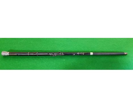 An unusual silver topped walking cane constructed from parts of a clarinet, 92cms long. Estimate £20-40.
