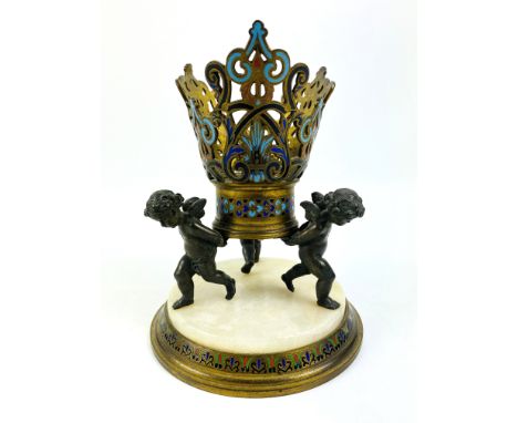A 19th century gilt bronze and champleve decorated epergne base with three winged bronze cherubs, and raised upon a circular 