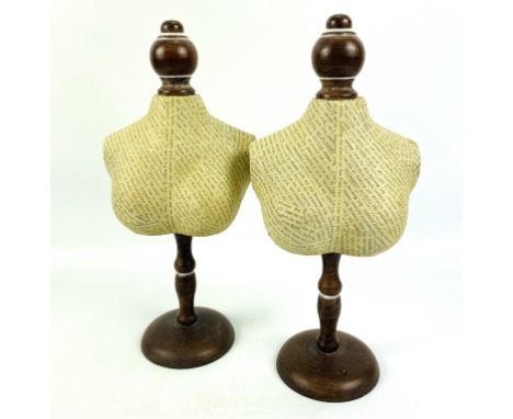 A pair of contemporary mannequin form display stands for jewellery, 16cms wide x 11cms deep x 35.5cms high. Estimate £20-30.