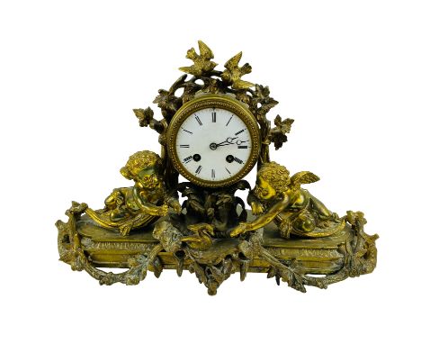 A late 19th century French decorative ormolu mounted mantel clock, with a drum movement and striking on a bell, signed Japy F