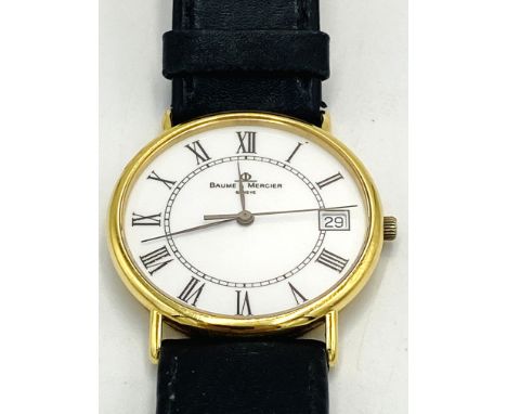 An 18ct quartz Baume &amp; Mercier gents quartz wrist watch, reference 15205 with white dial, Roman numeral numbers, inner ch