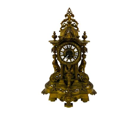 A large scale good quality 19th century French mantel clock with an enamelled cartouche Roman numeral dial, presented in a we