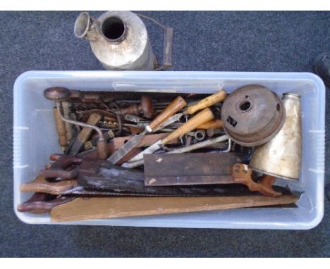 A large box of tools, saws and a Volcano kettle.