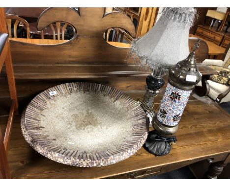 A fruit bowl inset with coral together with a contemporary table lamp with shade and a further Moroccan style table lamp.
