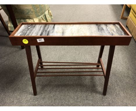 A mid century teak low side table with marble inset panel and under shelf, length 66 cm