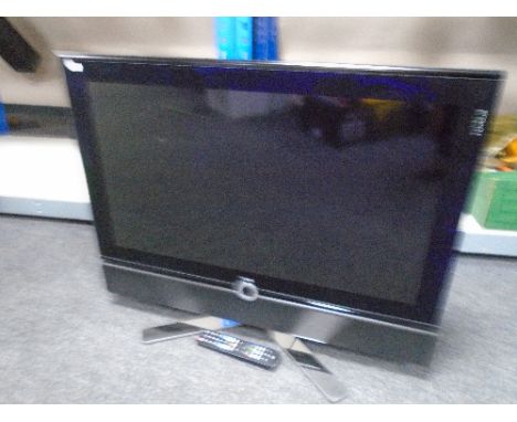 A collection of electricals including monitors, a DVD player, TV with remote control, projector and screen etc.
