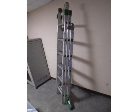 An aluminium triple section extension ladder.