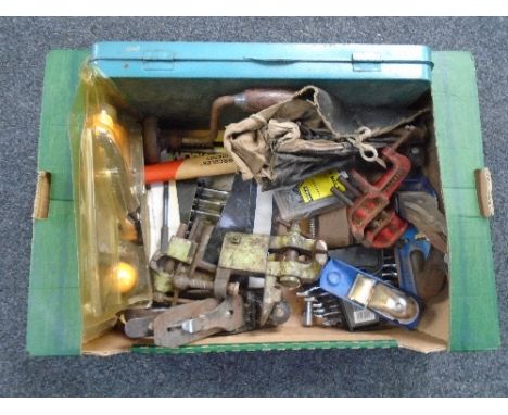 A box of tools including woodworking planes etc.