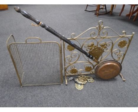A wrought iron fire screen together with a brass spark guard, antique copper headed bed warming pan and assorted horse brasse