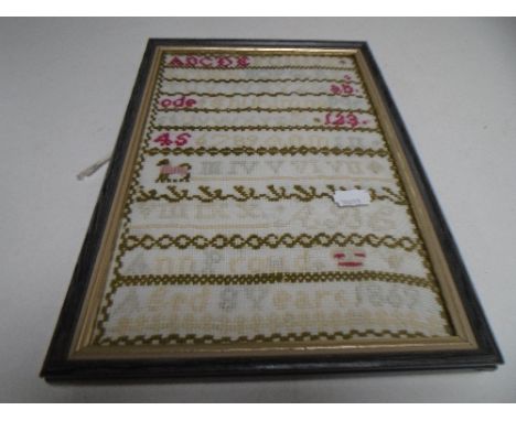 A late 19th century tapestry sampler dated 1869 