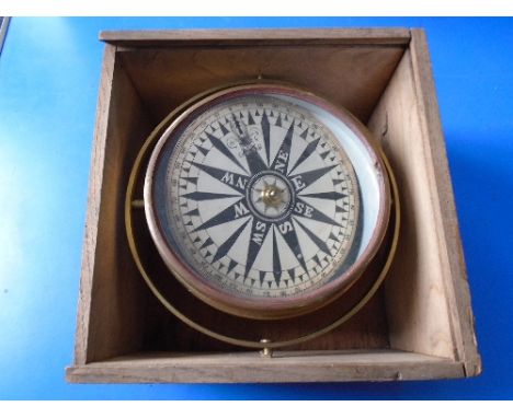 An antique brass ships compass in case 