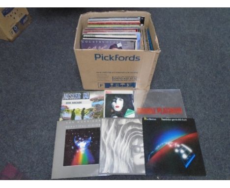 A box containing vinyl records including Elbow, Bob Dylan, Marvin Gaye, Deep Purple, Kiss, Van Morrison, Dio, Dire Straits et