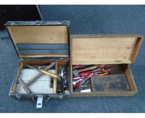 Two wooden tool boxes containing hand tools.