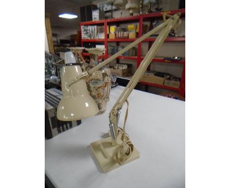 A mid century white metal angle poise lamp 