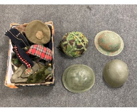 Four British Army metal helmets together with various other military related hats. (Q)