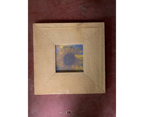 Three crates containing a total of 30 Fotolijst light wood finish photo frames, 10 cm x 10 cm, all brand new and still in ori
